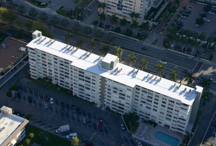 Commercial SPF Roofing - Condo Building with Spray Foam Roofing.